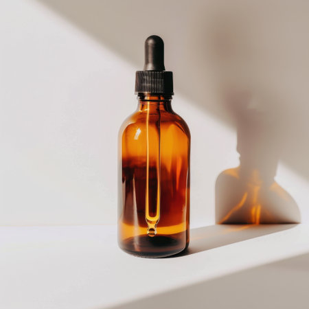 This amber glass dropper bottle with a sleek black lid is ideal for photography showcasing herbal remedies or essential oils, highlighting its elegant design and minimalist style.の素材