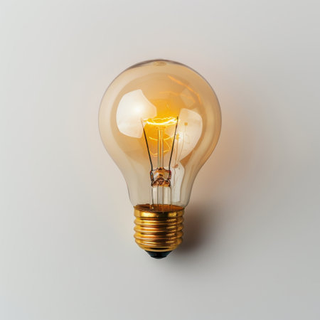 A beautifully crafted vintage light bulb shines with a warm glow, enhancing the atmosphere of any space. Ideal for home decor, it combines elegance and function.の素材