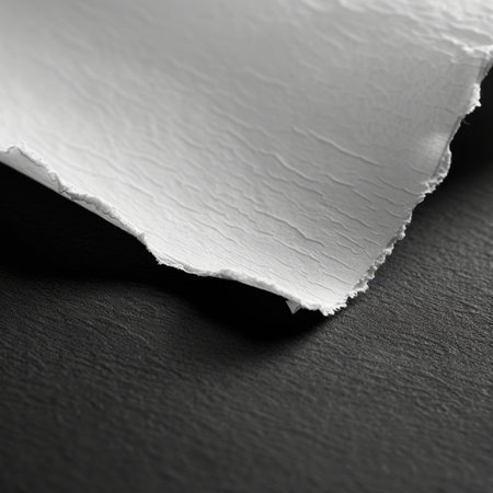 A detailed close-up of crumpled white paper texture against a black background, perfect for creative projects, design work, and artistic presentations. Ideal for backgrounds.の素材