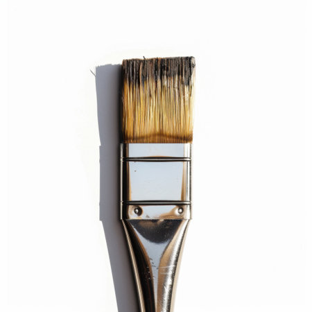 This close-up image showcases a paint brush with fine bristles against a clean white background, highlighting its details for artistic and creative purposes.の素材