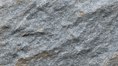 This high-resolution image features a detailed close-up of rough gray stone showcasing natural textures and patterns ideal for a variety of creative projects.の素材