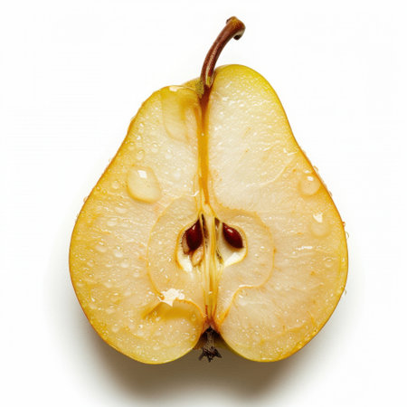 This image showcases a detailed close-up of a pear half, revealing its light yellow flesh glistening with water droplets. Perfect for food-related concepts.の素材