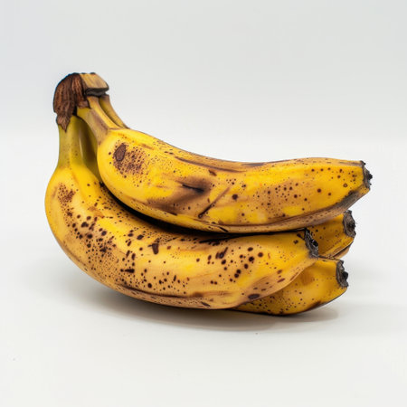 A vibrant image of fresh ripe bananas featuring rich yellow tones and natural light. Ideal for culinary projects, nutrition blogs, or food advertisements.の素材