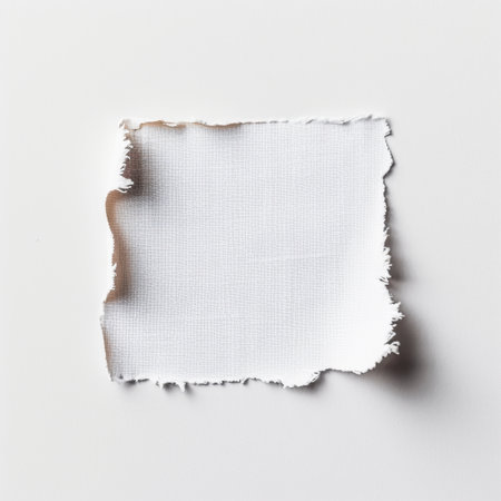 A square piece of white fabric showcasing raw edges on a plain background. Perfect for creative projects, textile design, or as a clean backdrop for various artistic endeavors.の素材