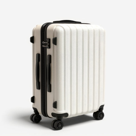 A sleek white hard shell suitcase with black accents, designed for modern travelers. This lightweight luggage features four swivel wheels, perfect for easy transport.の素材
