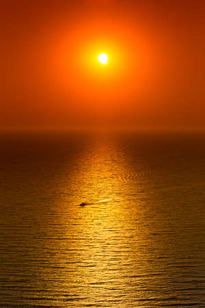 Red sunset over calm seaの写真素材