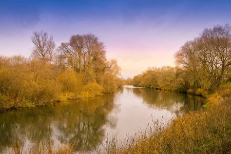 Autumn landscape - trees reflection in riverの写真素材
