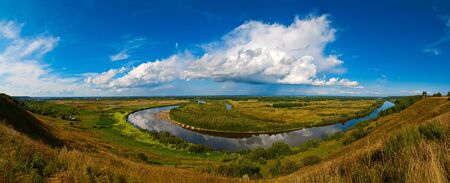 A wide panorama of the Russian landscape. Klyazma river under the cloudsの写真素材