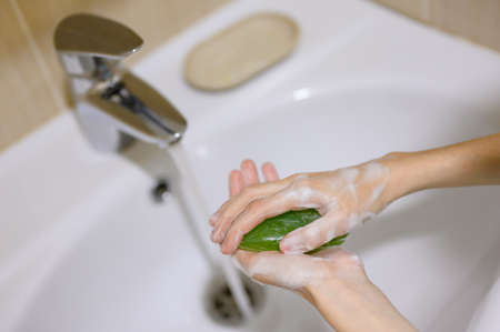 Hand washing as a protection against the virus.の写真素材