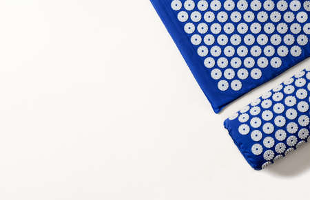 Massage mats on a white background. Alternative medicine concept.の写真素材