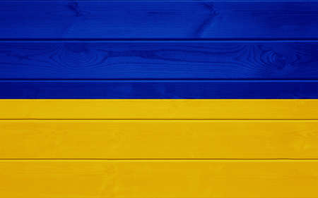 Ukrainian flag on a wooden surface.の写真素材