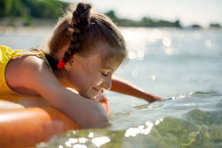 Girl swims in the warm sea