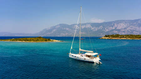 White yacht in the Aegean sea near the islands.の写真素材