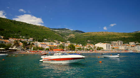 The boat stands in the sea opposite the resort town.の写真素材