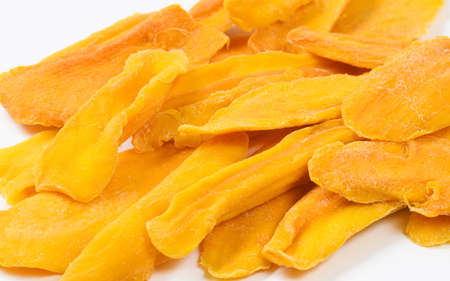 Many slices of dried mango close-up. Selective focusing at the center of the frame.の写真素材