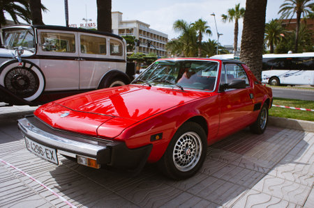 Salou, Spain - July 2013: Red retro Fiat car stands on display in Salou.のeditorial素材