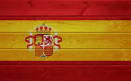 Spain flag on an old wooden surface. Wood textureの写真素材