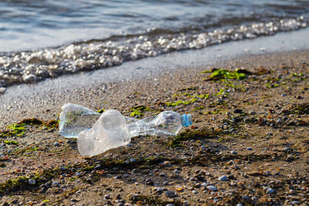 The ecological disaster of the modern world is the pollution of seas and oceans with plastic waste.の写真素材