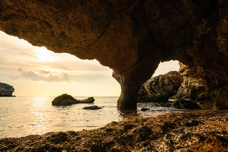 View of the beautiful and the sea from a huge dark cave in the Crimea.の写真素材