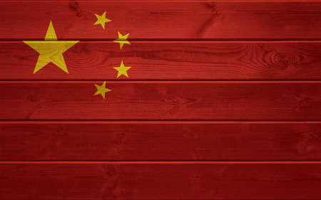 China flag on an old wooden surface. Old wood texture. National Day of the People's Republic of Chinaの写真素材