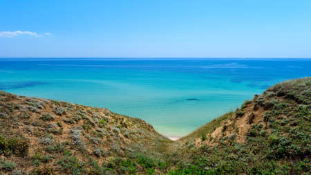 Seascape and hills in the foreground. Paradise wild beach.の写真素材