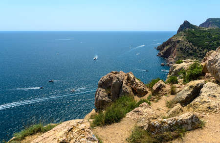 Rocky seashore on a summer sunny day.の写真素材