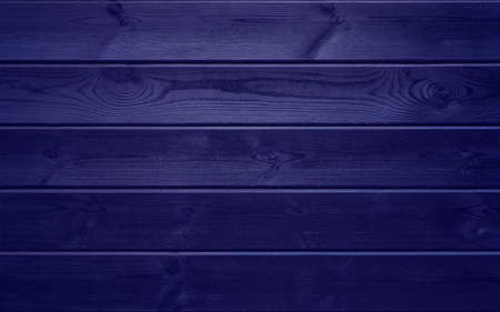 A textured wood wall in the color of the 2022 Very Peri trend. Abstract purple background. Copy space for textの写真素材