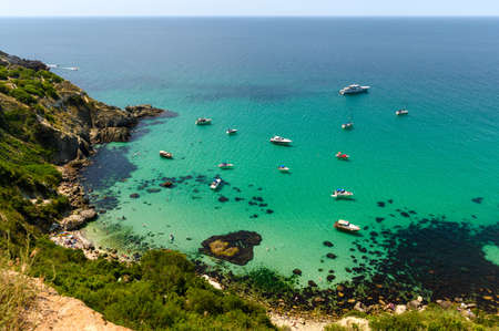 View from the mountain to the sea lagoon with yachts. Seascape in the Crimea. Selective focus of the sea with yachtsの写真素材