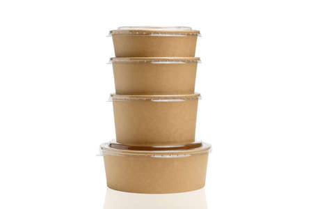 Several paper containers for food of different sizes on a white background. isolated object. Tableware made from biodegradable materials.の写真素材