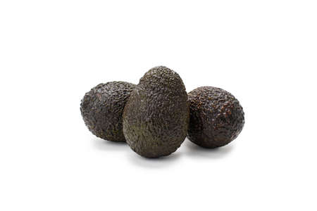 Dark avocados isolated on white background.の写真素材
