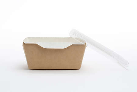 Paper eco-friendly container for food delivery with a transparent lid on a white background.の写真素材