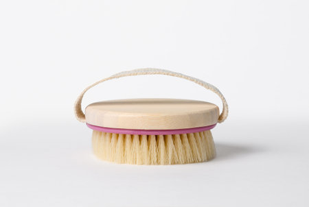 Brush for body massage on a white background.の写真素材