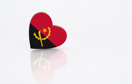 Flag of Angola in the shape of a heart on a white background. The concept of patriotism. copyspace.の写真素材