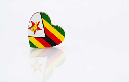 Flag of Zimbabwe in the shape of a heart on a white background. The concept of patriotism. copyspace.の写真素材