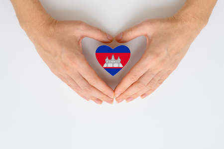 The national flag of Cambodia in female hands.の写真素材