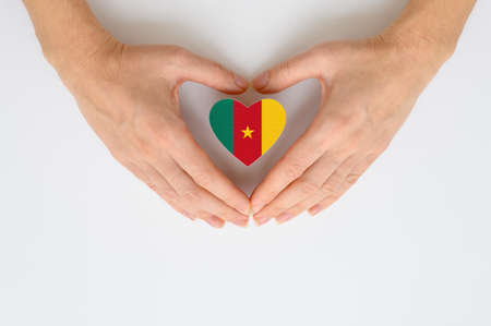 The national flag of Cameroon in female hands.の写真素材