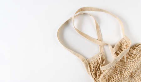 Eco friendly string bag on a white background. Concept of zero waste and environmental protection....
