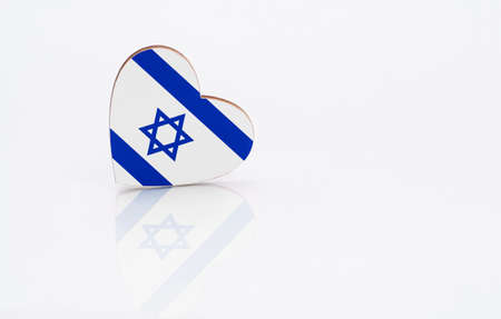 Flag of Israel in the shape of a heart on a white background. The concept of patriotism. copyspace.