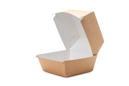 Open box for a big hamburger on a white background. Paper eco-friendly packaging for fast foodの写真素材
