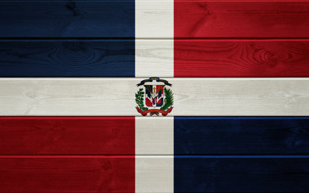 Flag of the Dominican Republic on old wooden surface.