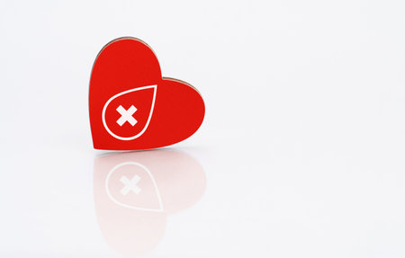 red heart with donor sign on white backgroundの写真素材
