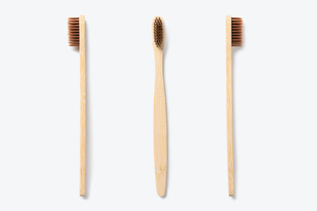 Wooden toothbrush on a light background. Eco friendly toothbrush.の写真素材