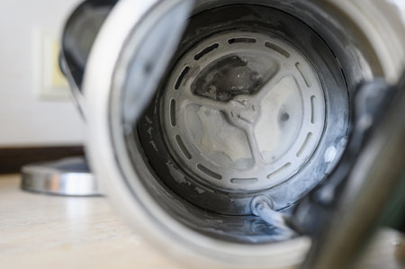 Limescale at the bottom of an electric kettle. The concept of poor quality waterの写真素材