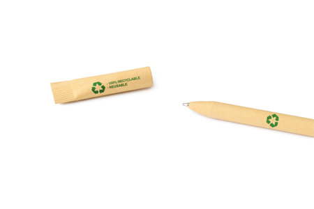 Zero waste and recycling concept. Disposable ballpoint pen made from recycled paper with a recycling sign. selective focusの写真素材