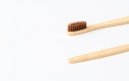 Wooden toothbrush on a light background. Zero waste concept. Everyday eco-friendly items made from biodegradable materials. copyspace.の写真素材