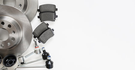 Auto parts for car service on a white background. Brake discs and other parts. copyspace.の写真素材