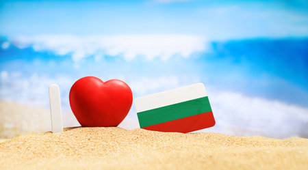 I love Bulgaria. Flag of Bulgaria on the beach with a red heart. vacation and travel concept.の写真素材