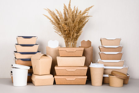 Containers and packaging for fast food made of paper and a bouquet of dried flowers. The concept of using products from biodegradable materials.の写真素材