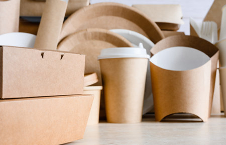 Close-up of paper disposable food containers. Eco-friendly biodegradable food packaging. Selective focus on the container in the foreground.の写真素材