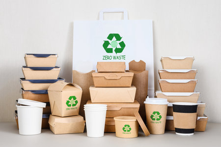Waste reduction. The concept of life with zero waste. Eco-friendly paper disposable tableware with a recycling symbol.の写真素材